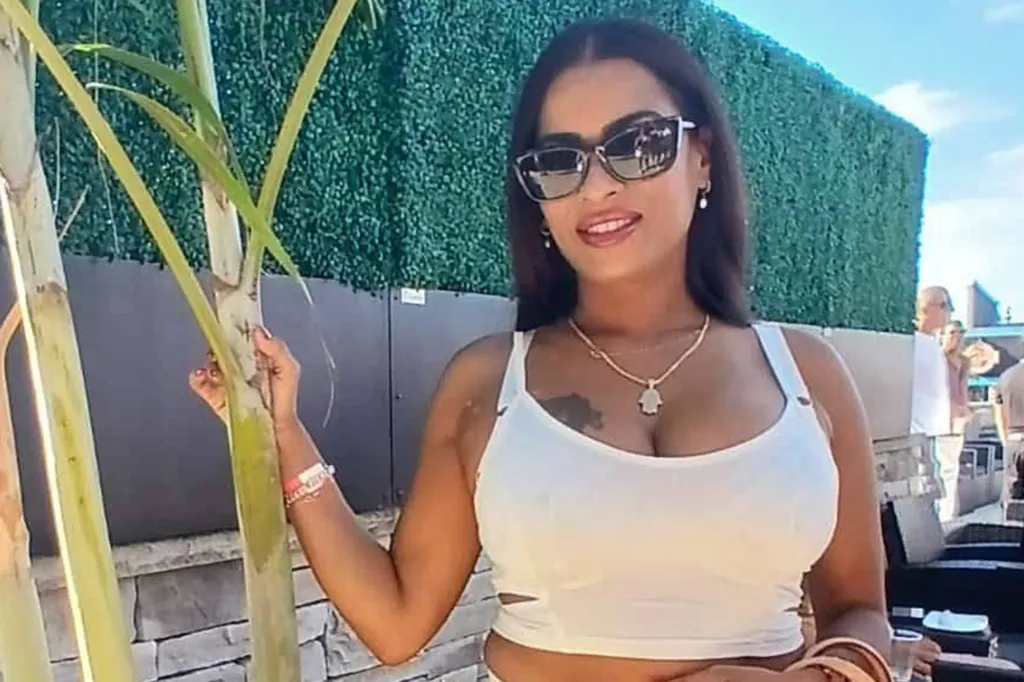 Rosana Kissoon, a 39-year-old woman, in sunglasses and white top, holding a plant.