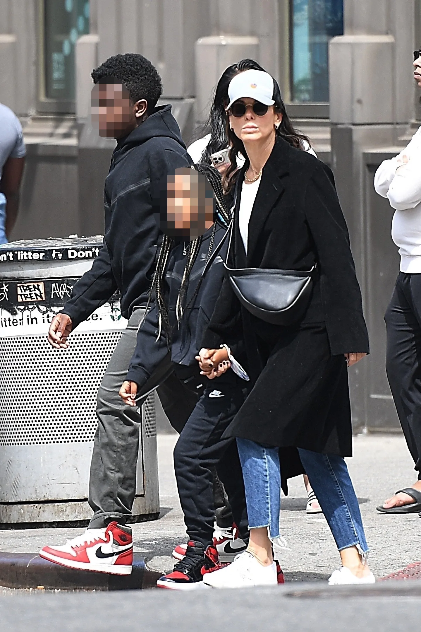 Sandra Bullock walks with her children Louis Bardo Bullock and Laila Bullock.