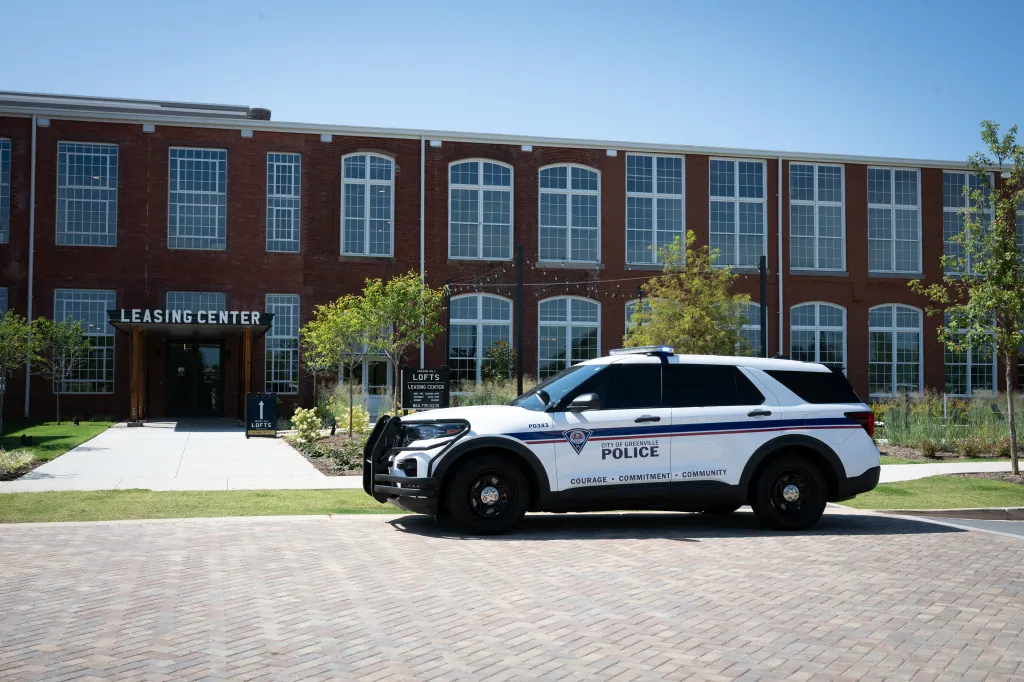 Greenville police vehicle outside the Judson Mill Lofts leasing center.