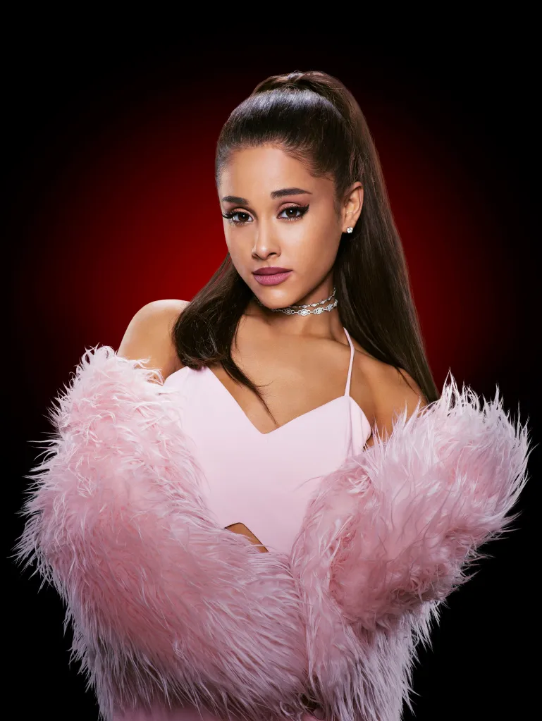 Portrait of Ariana Grande in a pink top and fluffy pink boa.