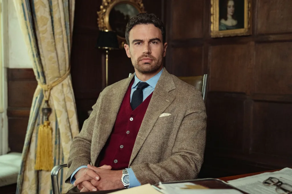 Theo James as James, looking at the camera in a room.