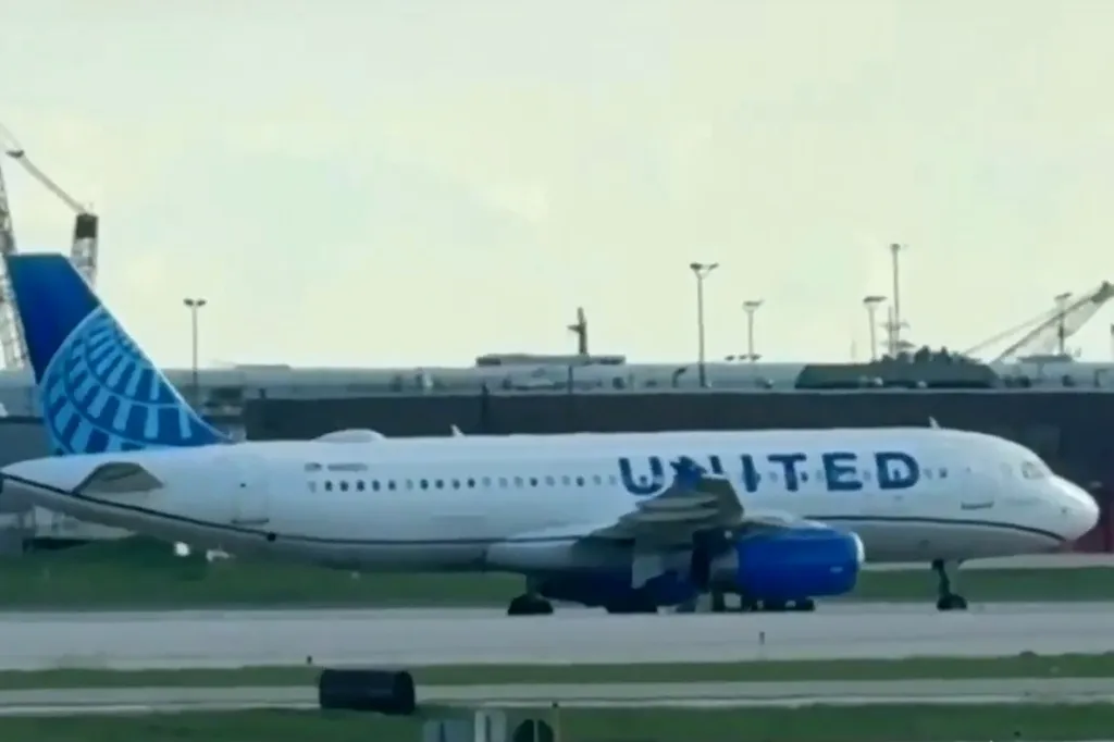 A United Airlines flight with a blown tire on a runway at Chicago's O'Hare International Airport.