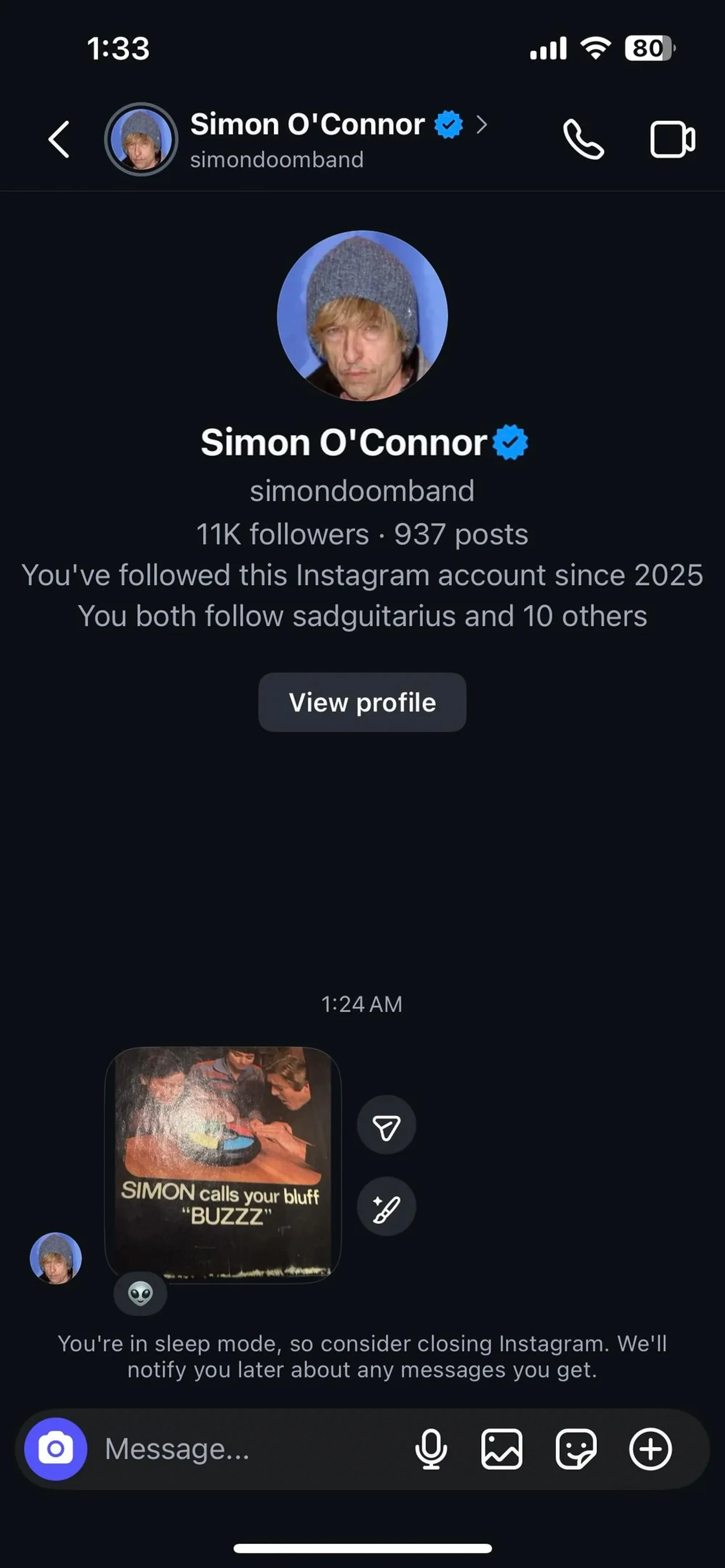 A screenshot of an Instagram direct message from Simon O'Connor with a picture of three men playing a board game.