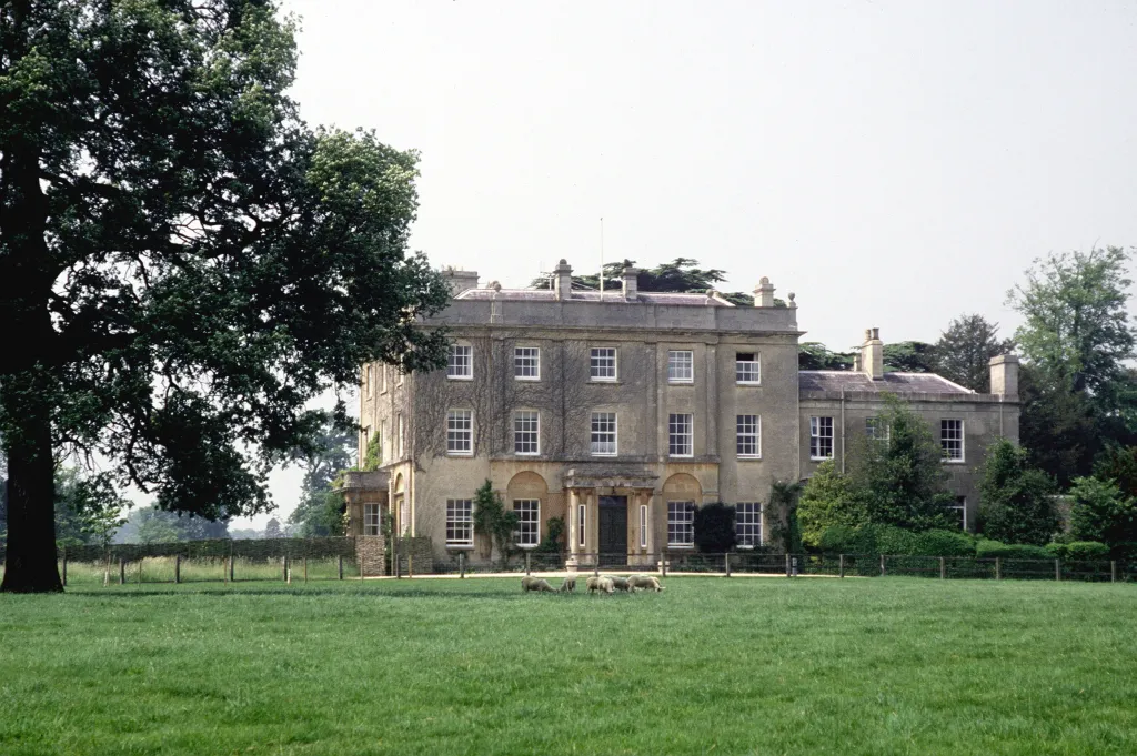 Highgrove House, the country home of Prince Charles, with sheep grazing on the lawn in front.