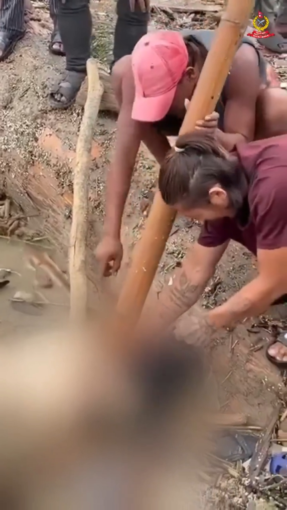 Two people allegedly stealing earrings from a flood victim.