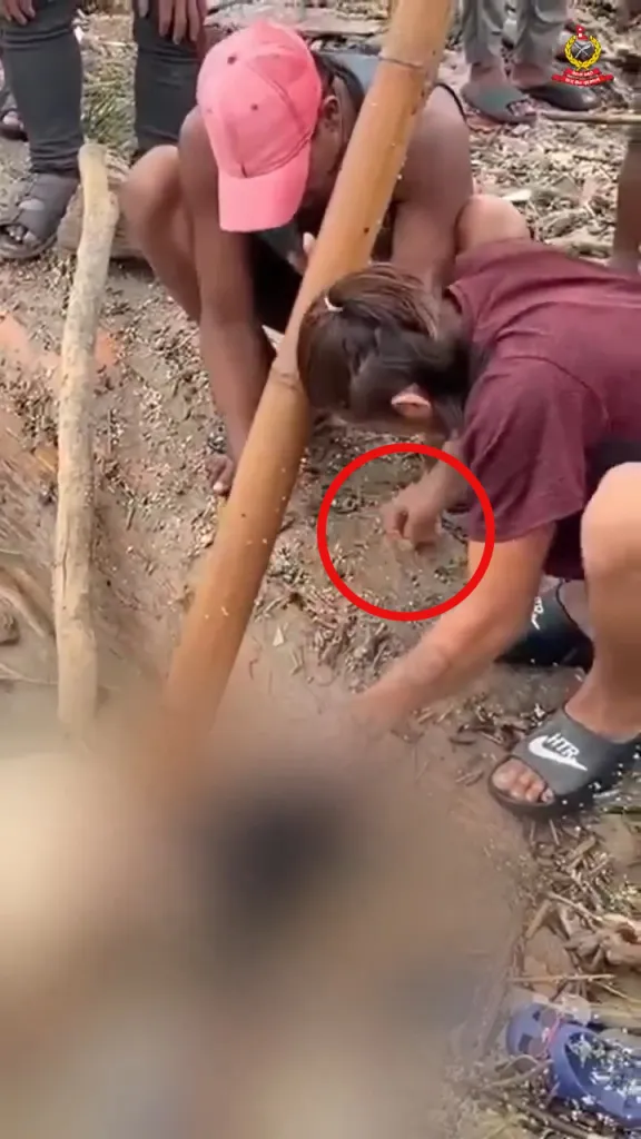 Two people allegedly stealing earrings from a flood victim in Nepal, with the victim's face blurred.