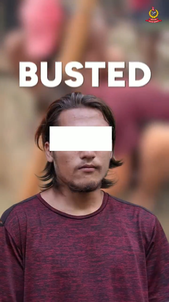 Man with censored eyes, red t-shirt, and 