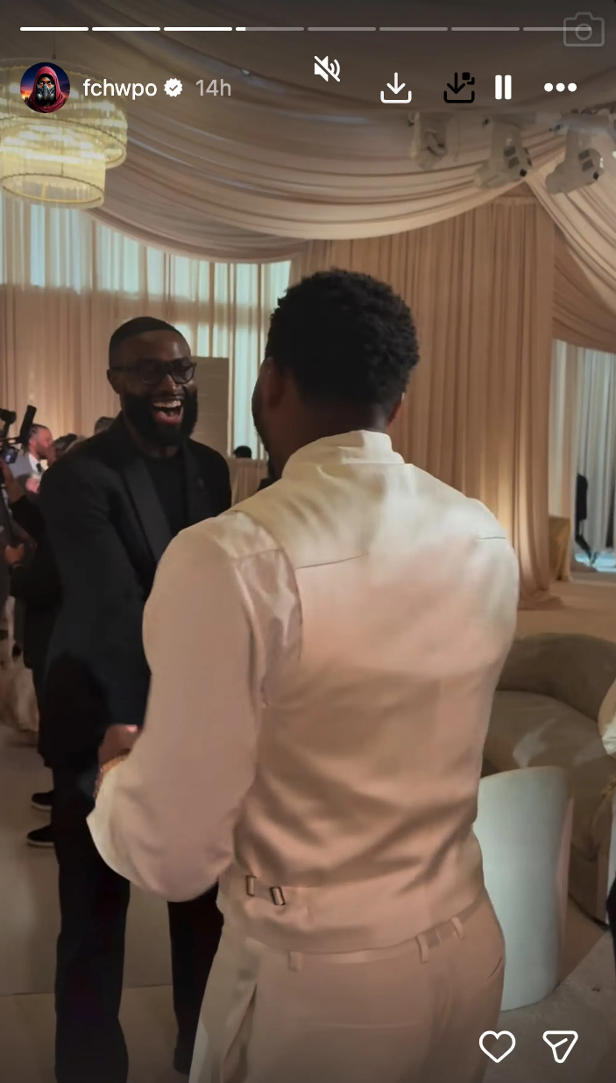 Coco Jones and Donovan Mitchell greet each other.