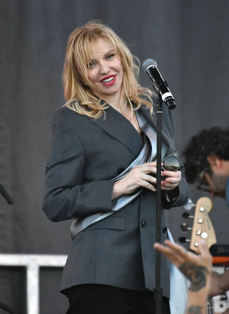 Courtney Love performing live on stage.
