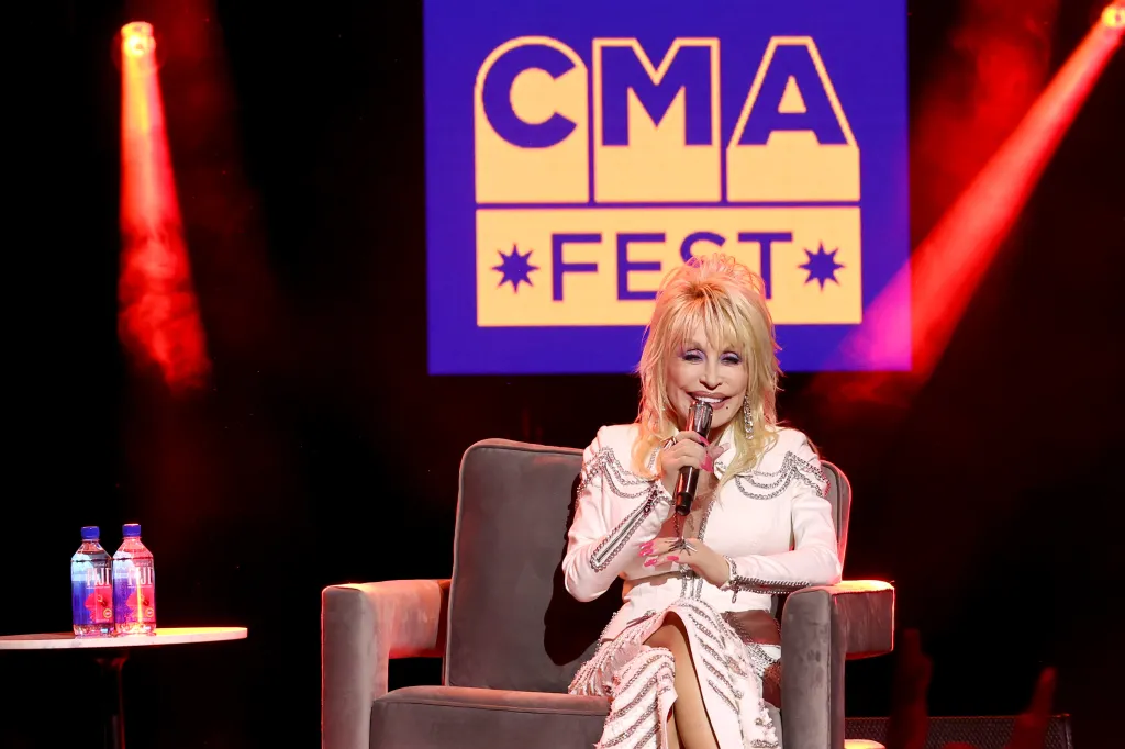 Dolly Parton speaking on stage at Music City Center.