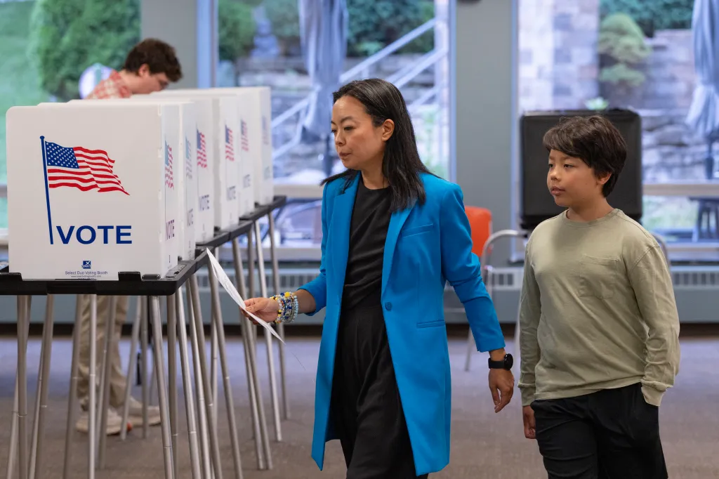 Francesca Hong and her son, George, casting their votes in the primary election.