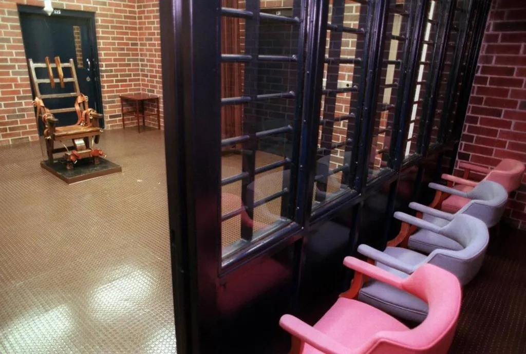 South Carolina's electric chair in the death chamber of Broad River Correctional Facility, with pink and gray chairs in the viewing room.