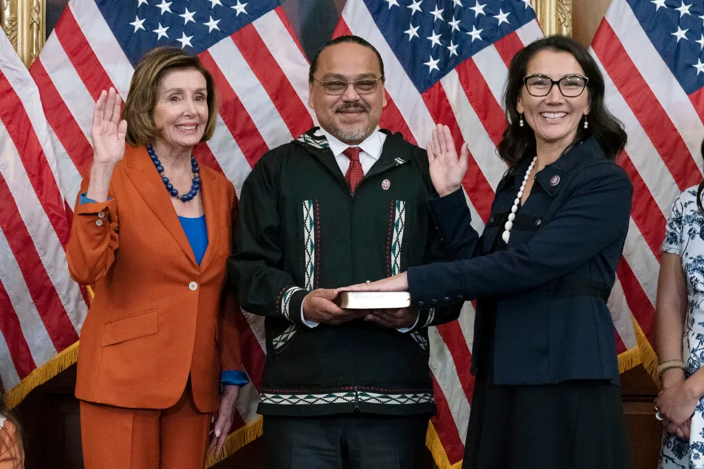 Speaker Nancy Pelosi administers the House oath of office to Rep. Mary Peltola, standing next to her husband Eugene Peltola Jr.
