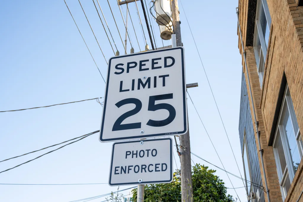 A speed limit 25 sign with a 