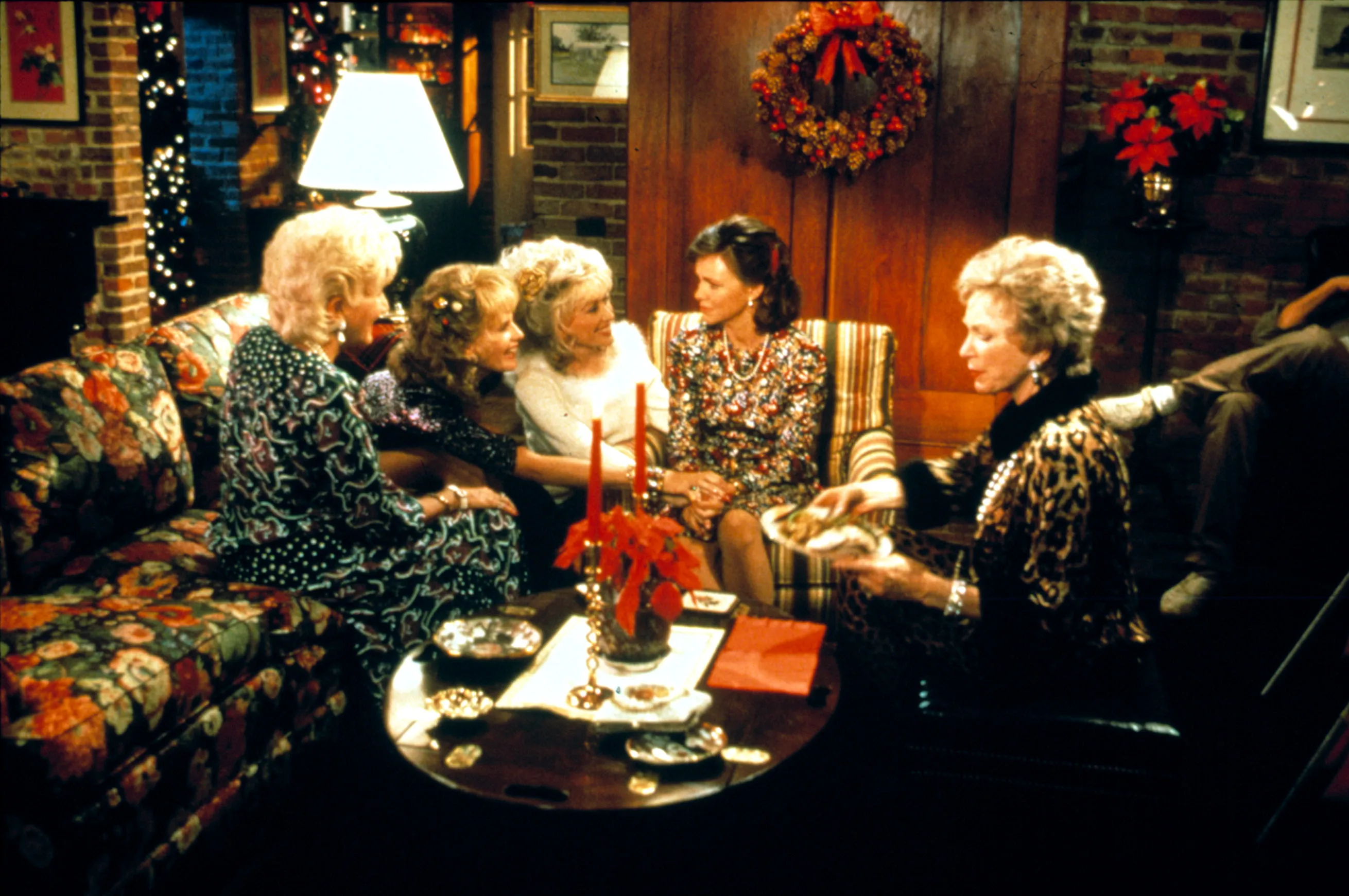 Dolly Parton, Sally Field, Shirley MacLaine, Olympia Dukakis, and Daryl Hannah in a festive living room from Steel Magnolias.