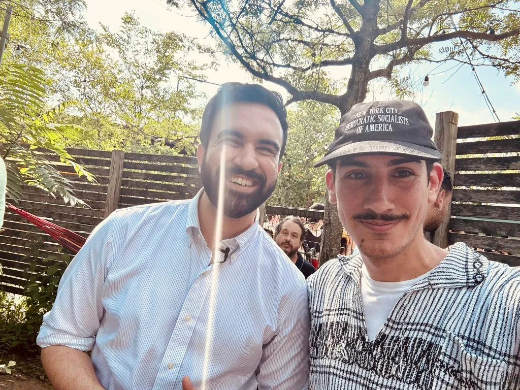 DSA co-chair Gustavo Gordillo and Mayor Mamdani pose for a photo.