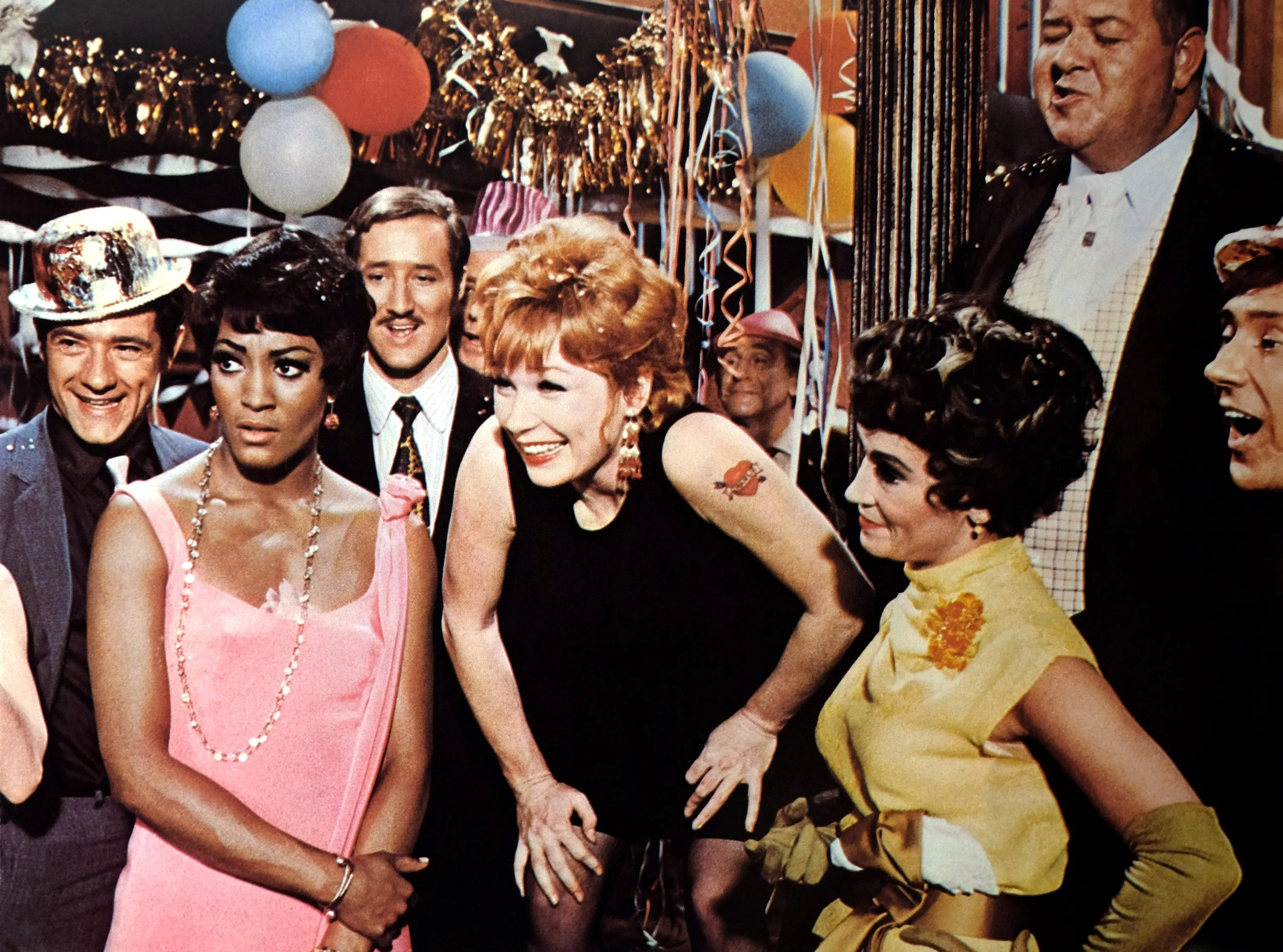 Paula Kelly, Shirley MacLaine, Chita Rivera, and Stubby Kaye in a scene from the film Sweet Charity.