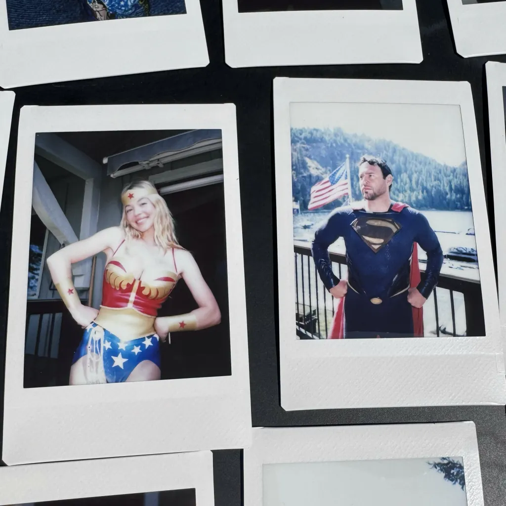 Two polaroid photos show Sydney Sweeney dressed as Wonder Woman and Scooter Braun as Superman.