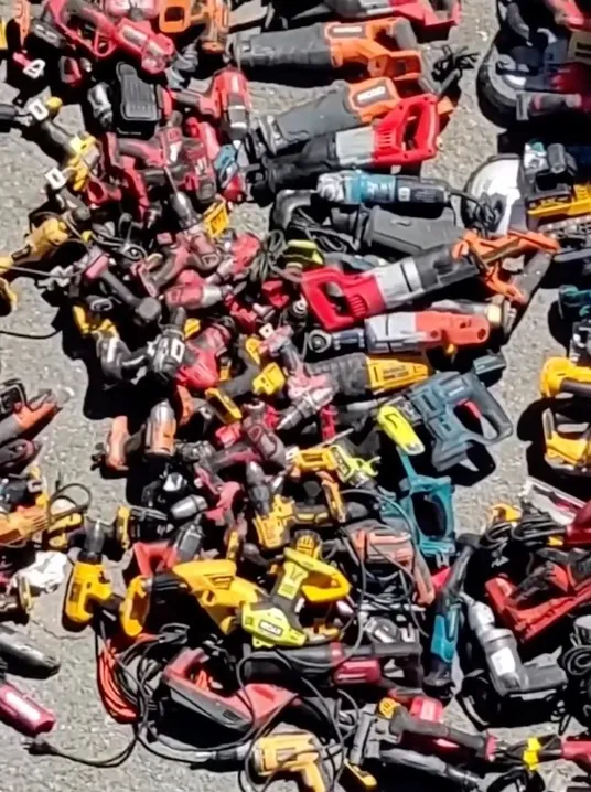 A large pile of power tools, including drills, saws, and sanders, recovered after a regional armed burglary series.