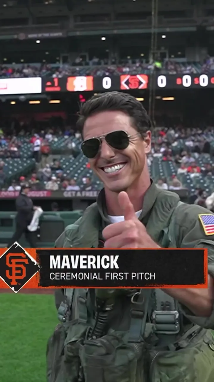 A Tom Cruise impersonator dressed as Maverick throws the first pitch at a San Francisco Giants game.