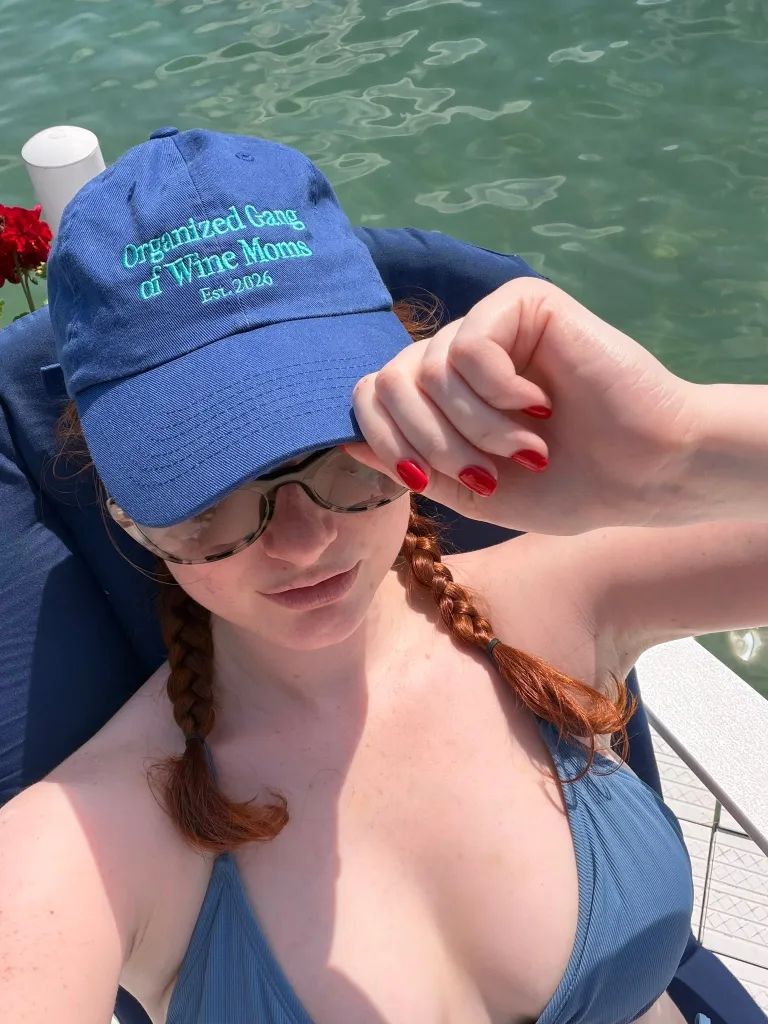 Grace Ryan, wearing a blue cap with the words 