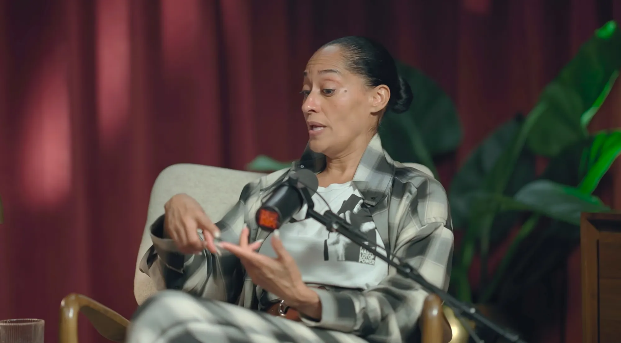 Tracee Ellis Ross speaking into a microphone.
