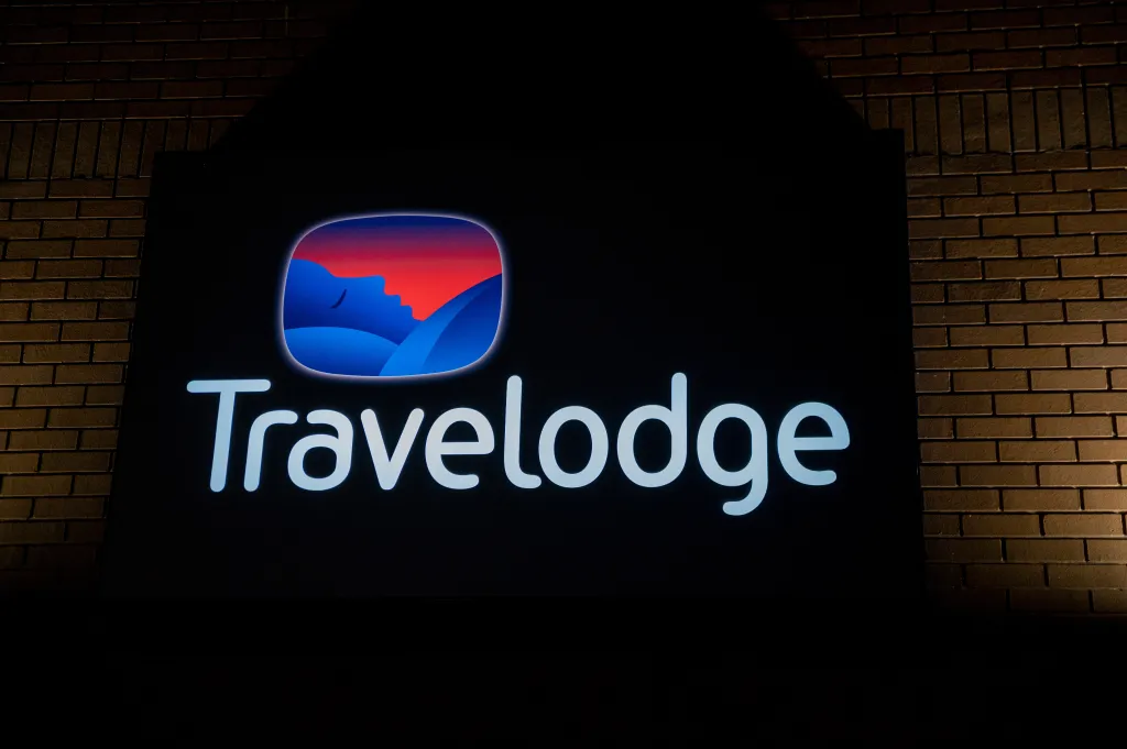 A Travelodge sign is seen at night at a Travelodge Hotel on Saturday, March 23, 2024, in London, UK. (1164642890)