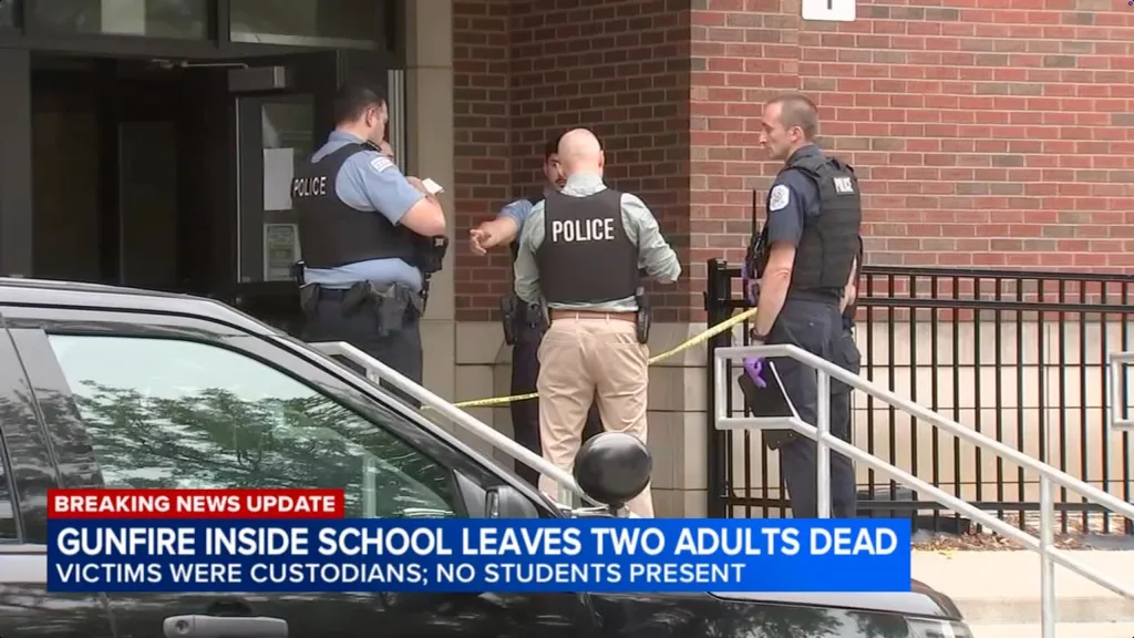 Police officers outside Mark Twain Elementary School after two custodians were found shot inside.