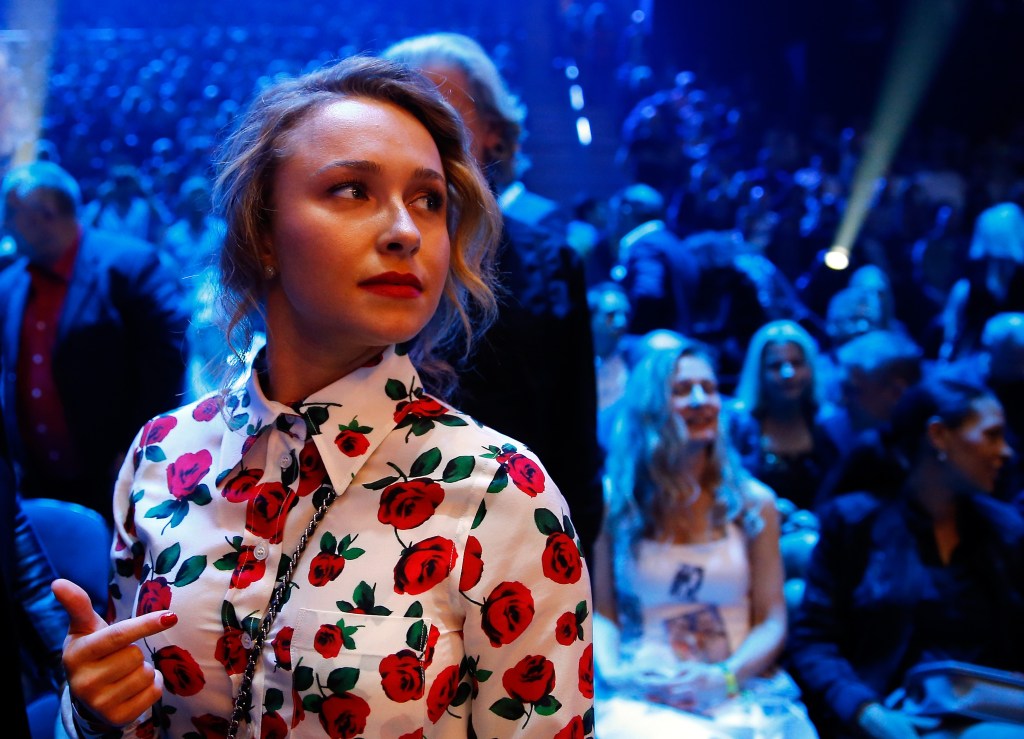Hayden Panettiere wearing a white button-up shirt with red rose patterns at the WBO heavyweight title fight.