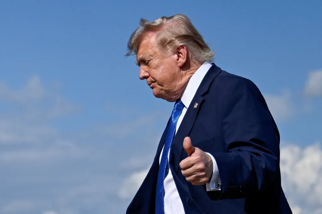 President Donald Trump gives a thumbs-up.