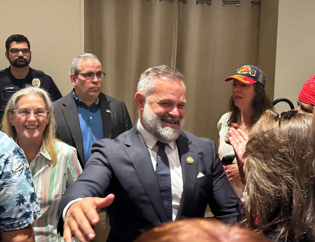 U.S. Rep. Cory Mills smiles while greeting supporters.