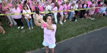 Women in pink rally in support of Lindsay Clancy who is on trial for killing 3 children