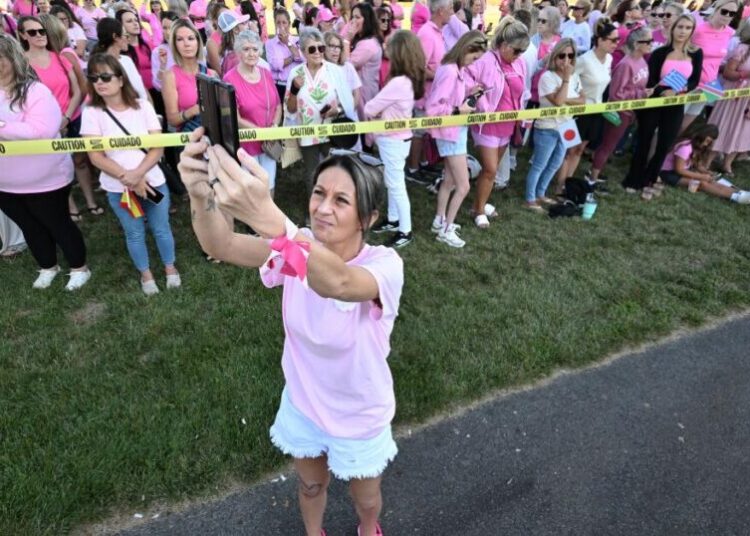 Women in pink rally in support of Lindsay Clancy who is on trial for killing 3 children