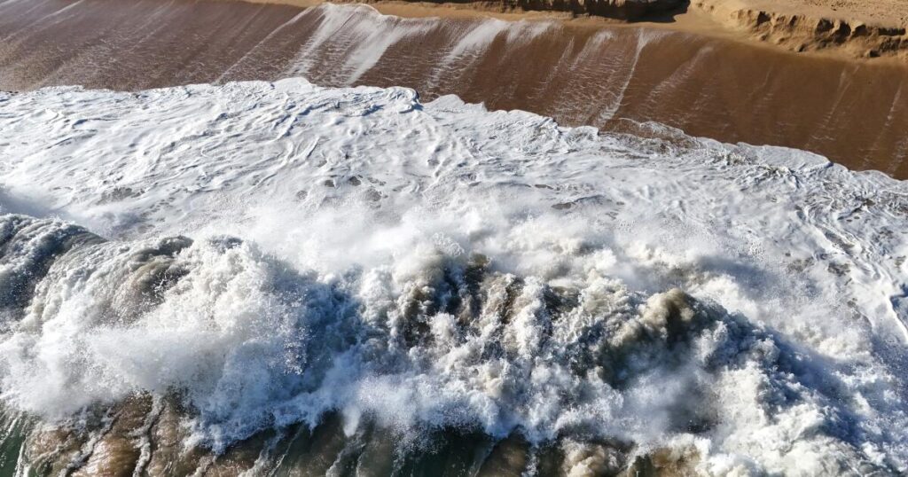 Stripped of sand, decades-old infrastructure ‘relics’ pop up at the Wedge in Newport Beach