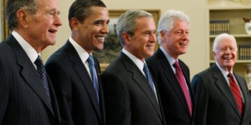 Trump goes unmentioned but not ignored as Clinton, Bush and Obama step up as essayists on presidents