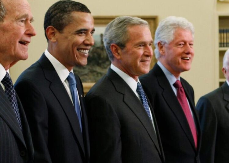 Trump goes unmentioned but not ignored as Clinton, Bush and Obama step up as essayists on presidents