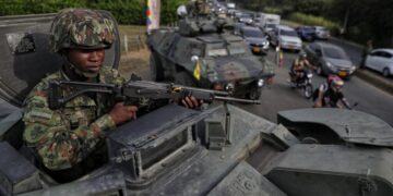 Colombia’s president to take office, vowing hard line against armed groups