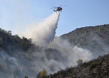 Firefighters battle massive wildfires in Belgium and Greece as 2 die on an island near Athens