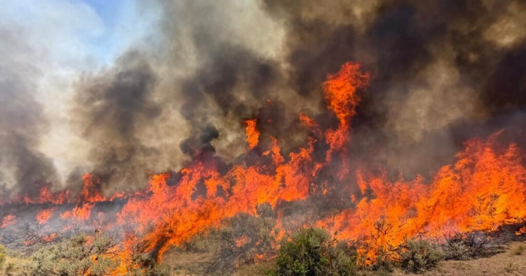 Helicopter battling Utah wildfire crashes, no word on the two aboard