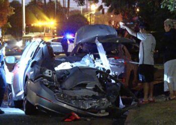 Driver fleeing police smashes into parked cars, shearing roof off a vehicle