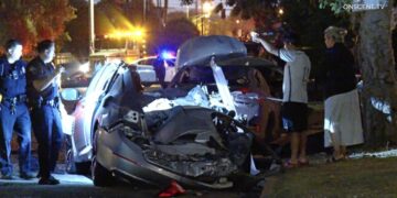 Driver fleeing police smashes into parked cars, shearing roof off a vehicle