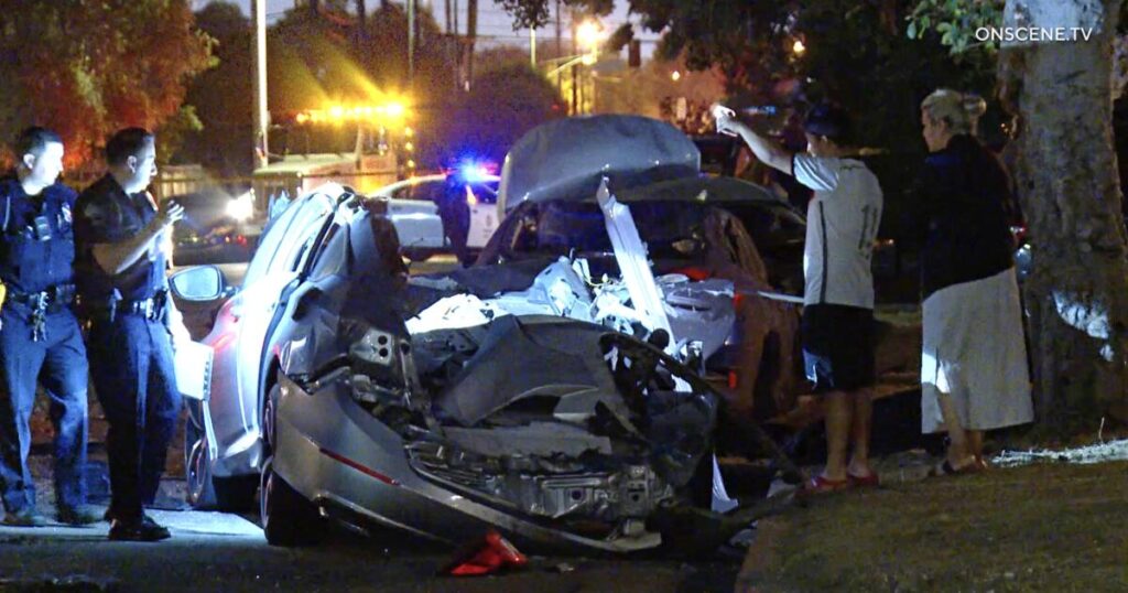 Driver fleeing police smashes into parked cars, shearing roof off a vehicle