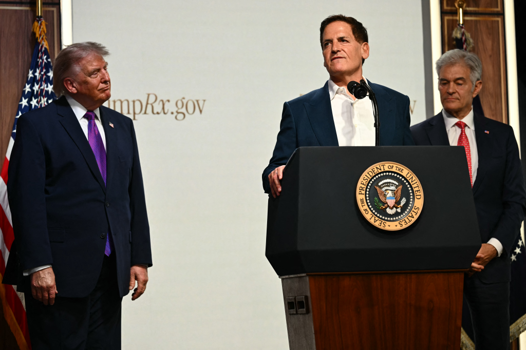 Mark Cuban speaks at a White House healthcare affordability event, with Donald Trump and Mehmet Oz standing nearby.