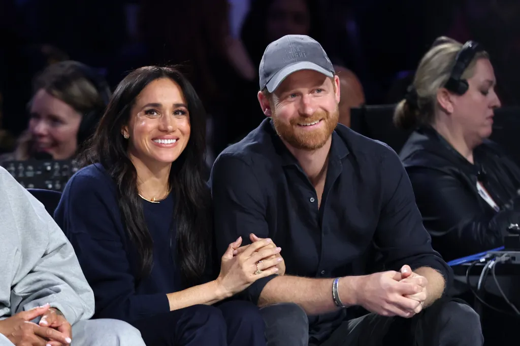 Meghan, Duchess of Sussex, and Prince Harry, Duke of Sussex, smiling at the 75th NBA All-Star Game.