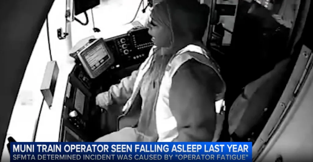 Black and white video capture of a Muni train operator appearing to nod off.