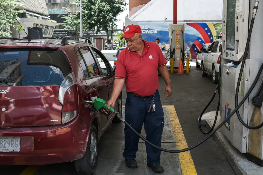A man pumps a car up with gas in Caracas, Venezuela, on Aug. 29, 2026.