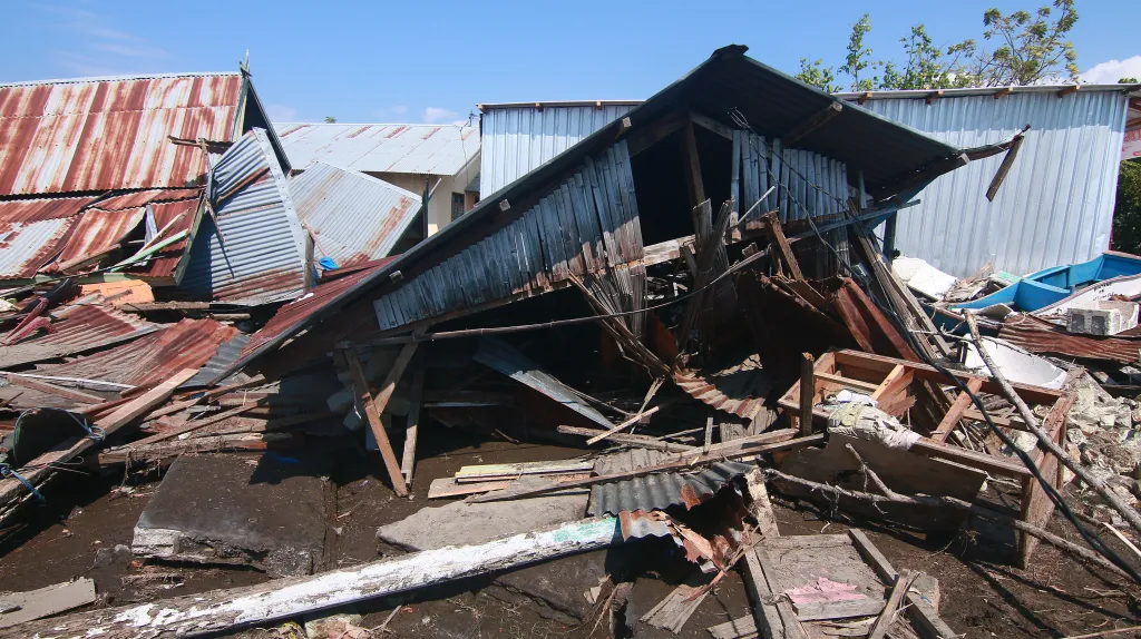 Destroyed homes and debris after a tsunami on Flores Island, Indonesia.