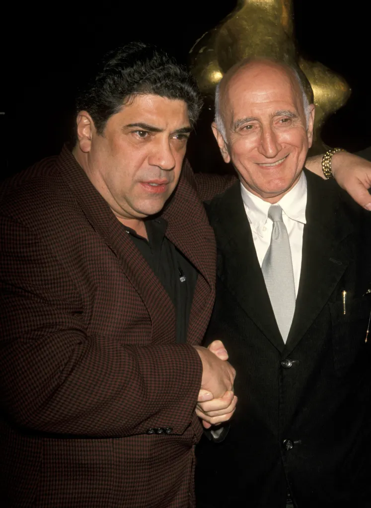 Vincent Pastore and Dominic Chianese shaking hands.