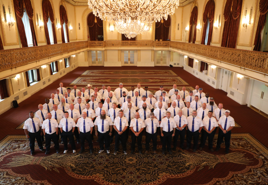 Walmart's team for the National Truck Driving Championships pose for a group photo.