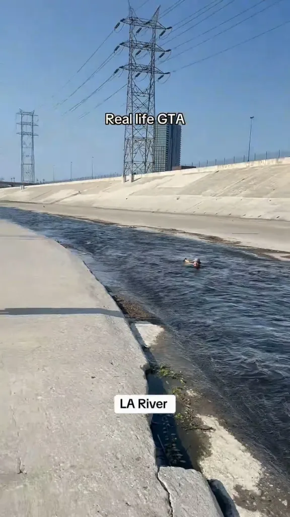 A woman floating down the Los Angeles River.